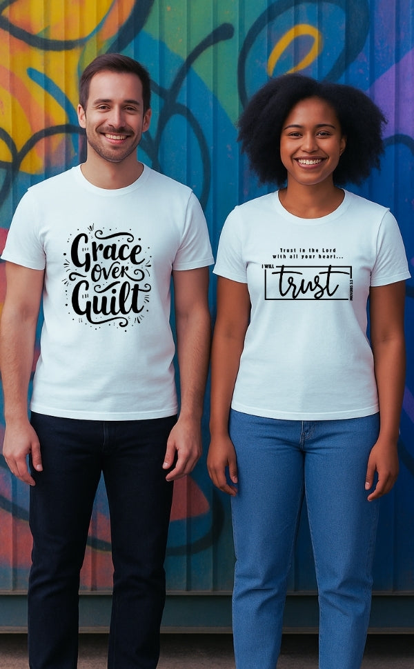 Two smiling models wearing VerseWear by L'authority Christian t-shirts with bold faith messages – 'Grace Over Guilt' and 'I will trust' – standing in front of a colorful graffiti wall