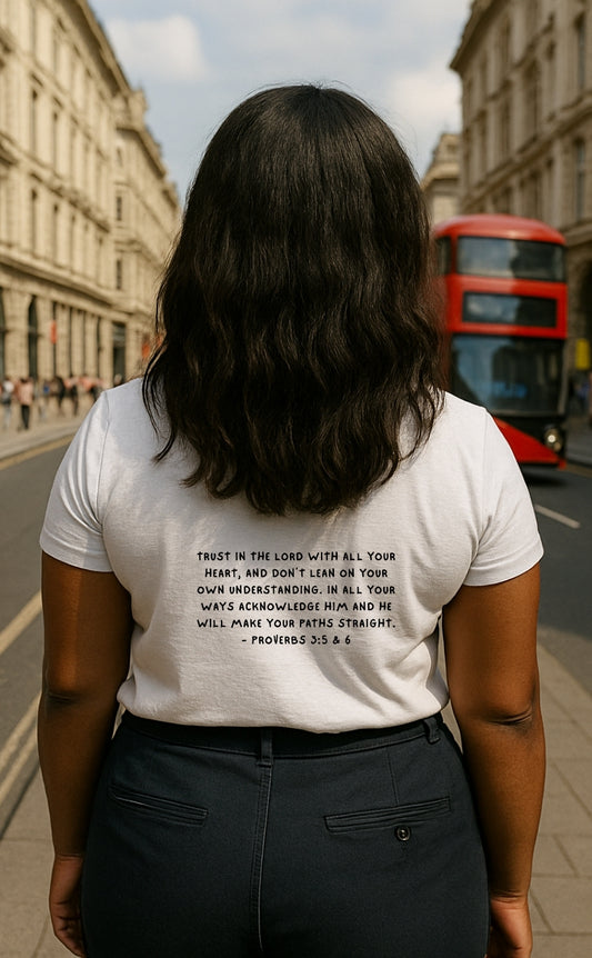 Back view of white t-shirt from VerseWear by L’authority with Proverbs 3:5–6 Bible verse – 'Trust in the Lord with all your heart... and He shall direct your paths' – Christian fashion photographed on London street.