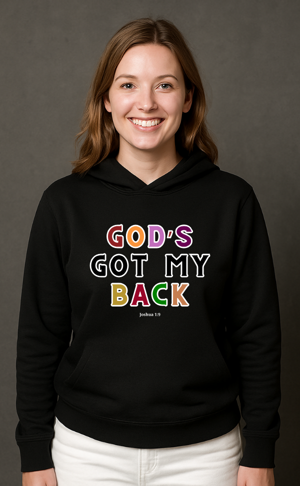 Smiling woman wearing black Christian hoodie from VerseWear by L'authority with bold multicolour text 'God’s Got My Back – Joshua 1:9' – faith-based streetwear