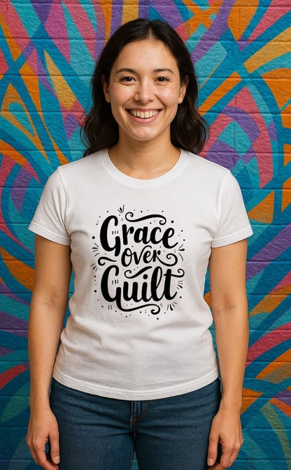 
Smiling woman wearing white t-shirt from VerseWear by L’authority with bold hand-lettered text 'Grace Over Guilt' – Christian streetwear captured against colorful mural background
